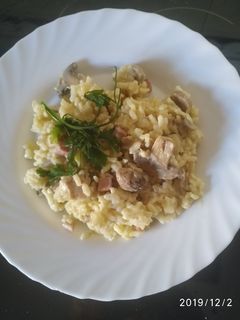 Una foto de Risotto con champiñón jamón y nata
