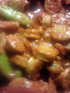 A picture of Italian sausage and peppers.