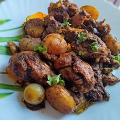 Pepper chicken legs roast with mushroom and potatoes A picture of Pepper chicken legs roast with mushroom and potatoes.