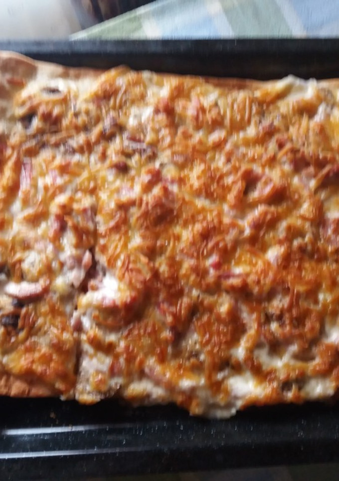 Una foto de Pizza carbonara