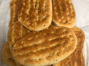 A picture of homemade bread with sesame seeds