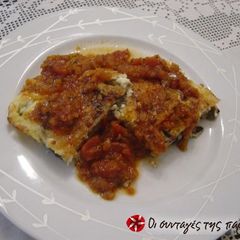 A picture of Eggplant soufflé with cheeses and sauce.