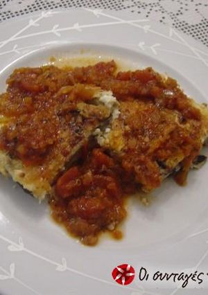 A picture of Eggplant soufflé with cheeses and sauce.