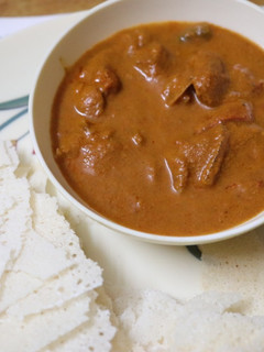 A picture of Mangalorean Chicken Gravy with Kori Roti.