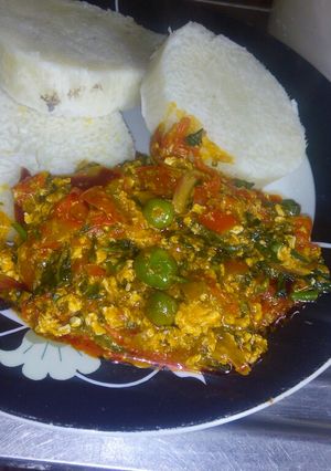 A picture of Garden egg /egg sauce with boiled yam.