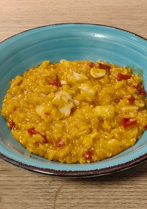 Una foto de Arroz meloso de bacalao y piquillo
