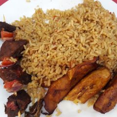 A picture of Jollof rice,fried plantain and beef.