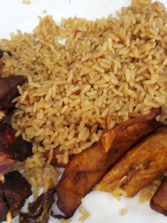 A picture of Jollof rice,fried plantain and beef.