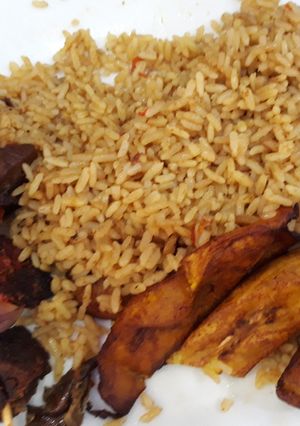 A picture of Jollof rice,fried plantain and beef.