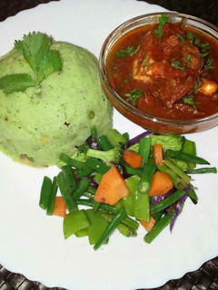 A picture of Mukimo beef stew and mixed vegetables.