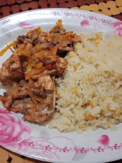A picture of Stir Fried chicken with Fried Rice.
