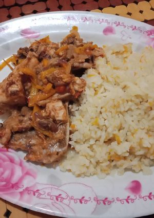 A picture of Stir Fried chicken with Fried Rice.