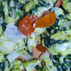 A picture of Scrambled Eggs with Spinach and Cherry Tomatoes.