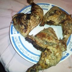 A picture of Braaied chicken legs.