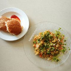A picture of Egg Bhurji with Paav/ scrambled eggs and buns.