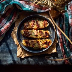 A picture of Basil pesto bruschetta with sun dried tomatoes and freeze dried cheese flakes.