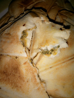 A picture of Toasted bread with veg saurce.