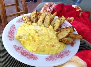 Una foto de Cachetes de abadejo a la crema de sidra y curry
