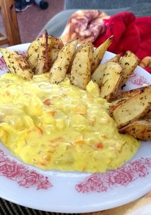 Una foto de Cachetes de abadejo a la crema de sidra y curry