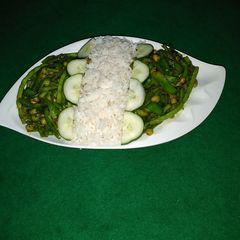 A picture of White rice and greens.