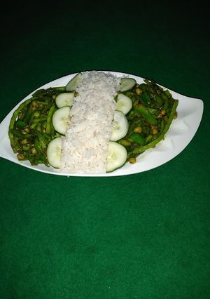 A picture of White rice and greens.