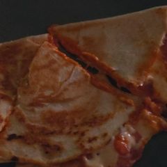 A picture of My cheese and tomato wrap.