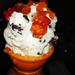 A picture of Ice cream with jelly and chocolate flavor.