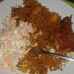 A picture of Shrimp Basmati Jollof Rice with Cole slaw and stewed n.