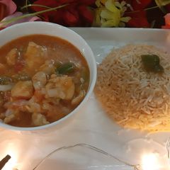 A picture of Peri chicken with peri rice.