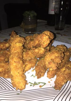 Una foto de Pollo crispy con queso cheddar