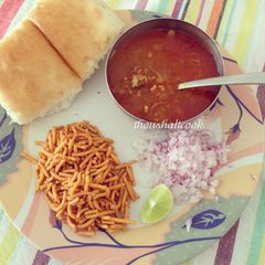 A picture of Misal Pav or Spicy Lentil Sprout Stew.