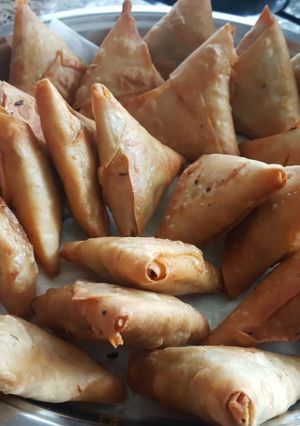 A picture of Chicken charcoal samosas.