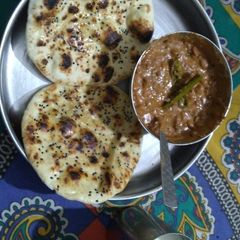 A picture of Butter naan with dal makhani.