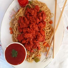 A picture of Tandoori Chicken and Vegetables Spaghetti.