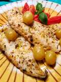 Nasello al cartoccio con uva, zenzero, limone e pepe di Sichuan