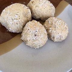 A picture of Bread balls with coconut sprinkles.