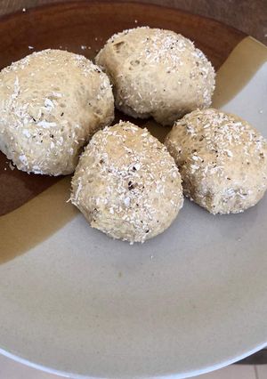 A picture of Bread balls with coconut sprinkles.