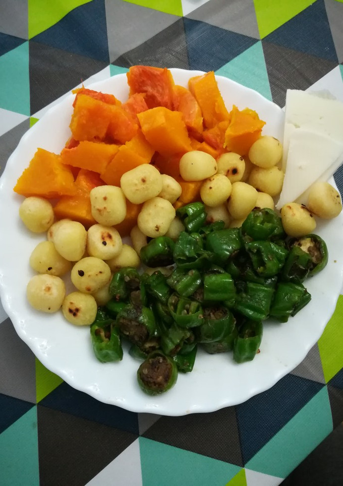 Una foto de Ñoquis con calabaza y pimientos