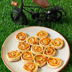A picture of চিসী ক্যারোট পিনহুইল (Cheesy carrot pinwheel recipe in Bengali).