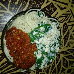 A picture of Spaghetti with omelette and stew.