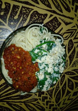 A picture of Spaghetti with omelette and stew.