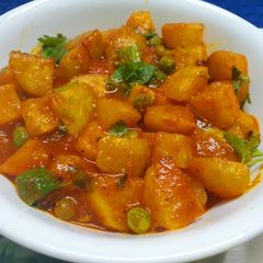 A picture of Turnip and Potato Curry with Green Peas.