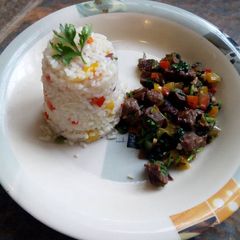 A picture of Beef fry with fried rice.