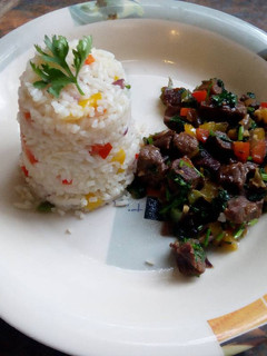 A picture of Beef fry with fried rice.
