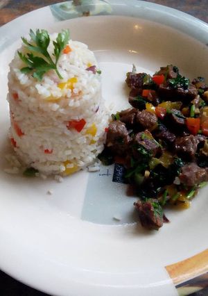 A picture of Beef fry with fried rice.