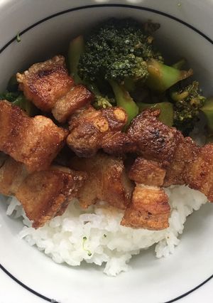 A picture of Crispy Pork Rashers with Sticky jasmine rice.