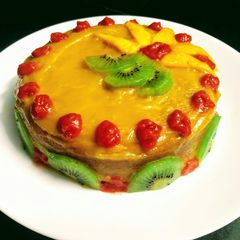 A picture of Mango Cake With Mango Glaze.