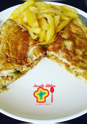 A picture of Veggies omelette with fried potatoes.