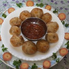 A picture of Vegetables schezwan momos.