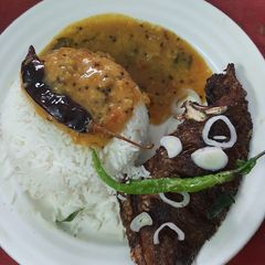 A picture of Fried fish khati daal and plain rice.